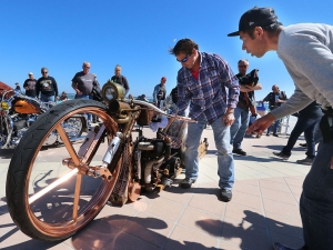 Bikers check out on of the many motorcycles on display at the 28th Annual boardwalk/Full Throttle Classic Bike Show in Daytona Beach Friday March 17,  2017. [News-Journal/JIM TILLER ]