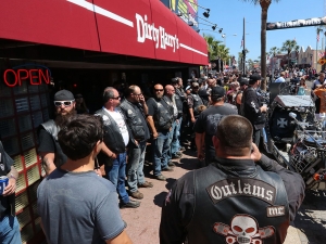 Daytona Beach Police keep an eye on  members of the Outlaws Motorcycle Club who showed up wearing their colors on Main Street in Daytona Beach Saturday March 18,  2017. [News-Journal/JIM TILLER ]