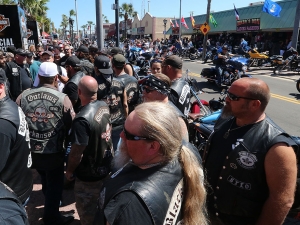 Members of the Outlaws Motorcycle Club pack the sidewalk along Main Street after being ask to leave Dirty Harry's Bar where wearing you clubs 'colors' isn't permitted as Bike Week 2017 heads into it's last weekend in Daytona Beach Saturday March 18,  2017. [News-Journal/JIM TILLER ]
